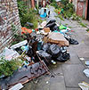 Dumped waste in an alleyway