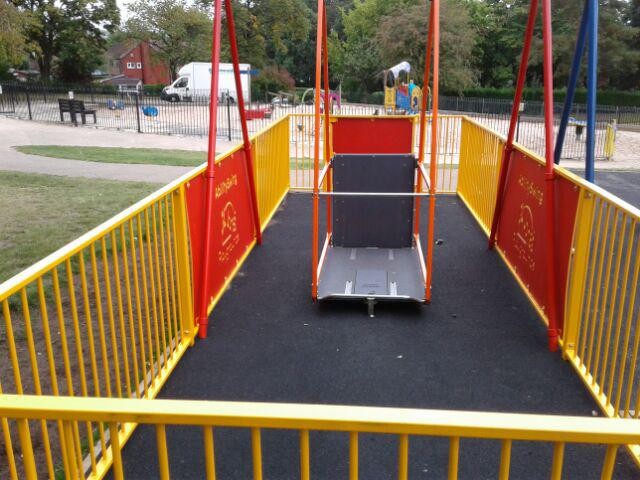 Wheel chair accessible swing