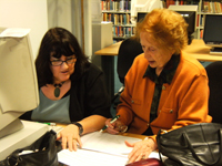 Volunteer helping researcher with her family history