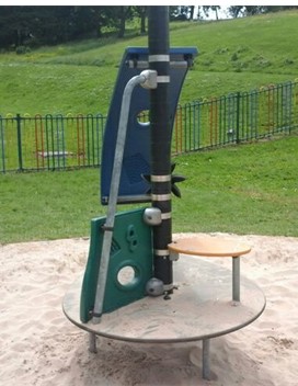 Multi-play unit including climbing bars, sliding poles, climbing rope and climbing board situated on wetpour