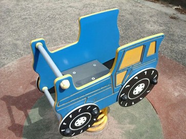 Tracker spring rocker situated on wetpour