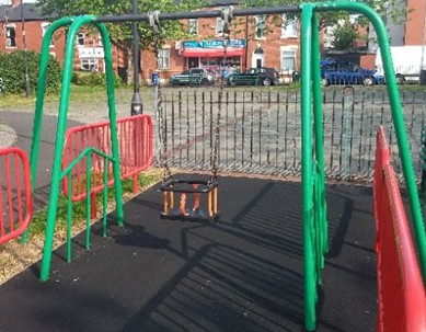 Car spring rocker situated on grass matting