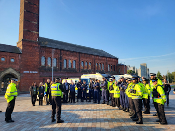 Police in semi circle on an open square