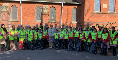 Group of volunteers outside a building